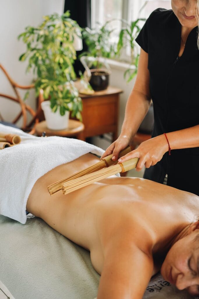 A serene bamboo massage session focusing on relaxation and wellness in a spa setting.
